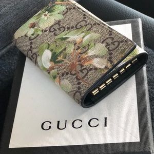Tan Gucci keychain with flowers